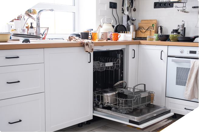 Dishwasher open in a modern kitchen, showcasing kitchenware and pots inside.