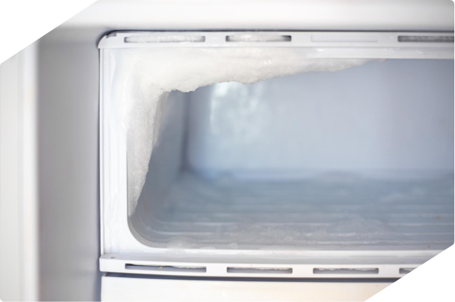 Frosted interior of a freezer showing ice buildup due to improper defrosting or door seal issues.