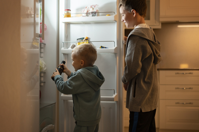 Kids accessing a family-friendly refrigerator, ideal for families with children. Features accessibility and organization.