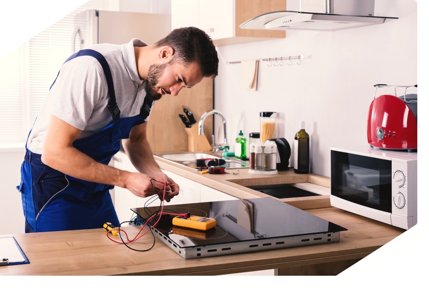 Technician repairing an oven, providing professional appliance repair services.