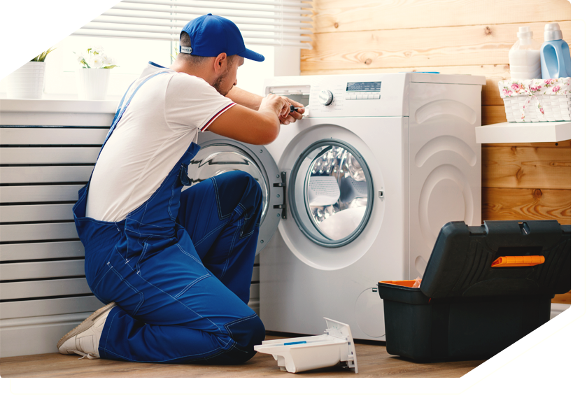 Technician repairing a stovetop, providing expert appliance repair services.